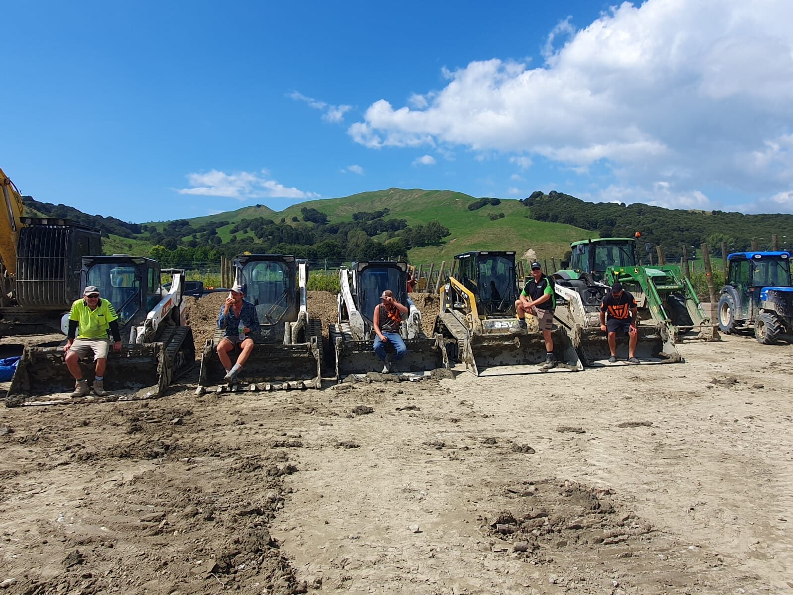 The crew of bobcat and skid steer operators taking a break on site